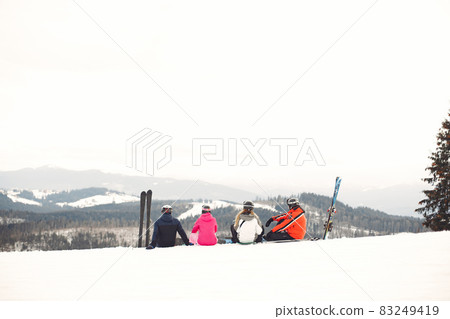 People snowboarding in the mountains with the snowboard People snowboarding in the mountains with the snowboard 83249419