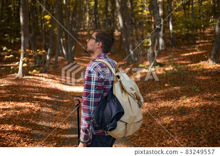 Caucasian male model outdoors in nature. 83249557