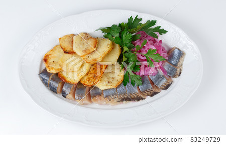 Image of pickled herring with potato and onion, top view 83249729