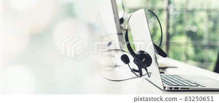 Headset and customer support equipment at call center ready for actively service 83250651