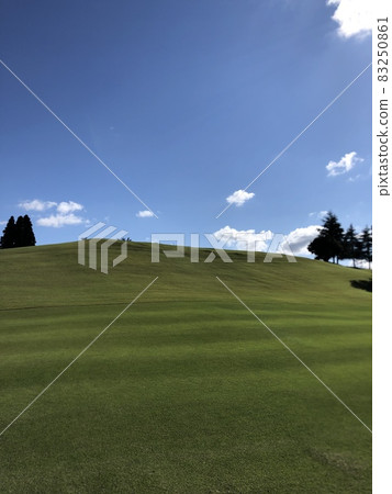 Blue sky green hill ~ 83250861