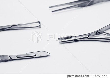 Surgical instruments isolated on the white background focus on scalpel blade Surgical instruments isolated on the white background focus on scalpel blade 83251543
