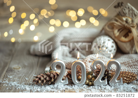 Festive New Year background with candles in the form of the numbers 2022. Festive New Year background with candles in the form of the numbers 2022. 83251872