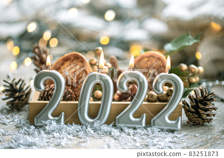 Festive New Year background with candles in the form of the numbers 2022. 83251873