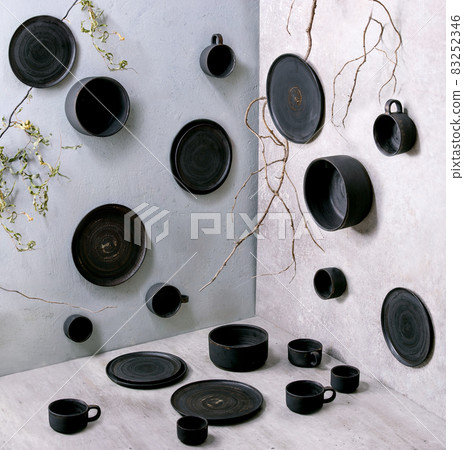 Set of empty black handcrafted ceramic plates Set of empty black handcrafted ceramic plates 83252346