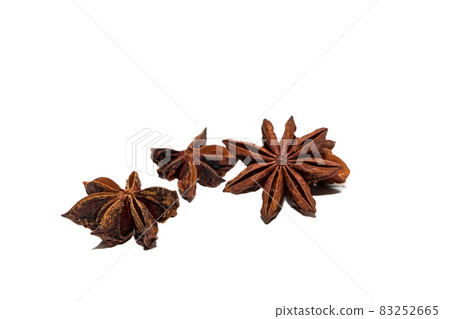 Fragrant anise isolated on a white background. Stars of dried flavorful anise isolated on a white background 83252665