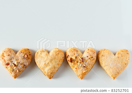 Heart shaped cookie frame on a white background. Four heart shaped macaroons on a white background. Place for your text, design for valentines day. 83252701