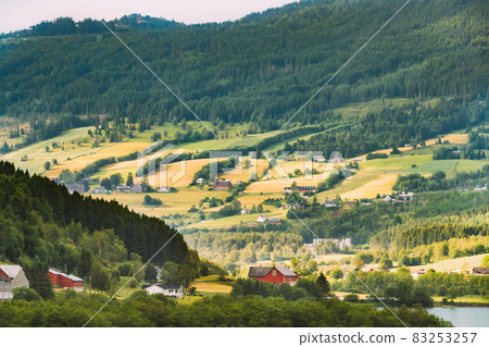 Byrkjelo Village, Sogn Og Fjordane County, Norway. Beautiful Sky Above Norwegian Rural Landscape. Bergheimsvatnet Lake In Summer Day. Agricultural And Weather Forecast Concept Byrkjelo Village, Sogn Og Fjordane County, Norway. Beautiful Sky Above Norwegian Rural Landscape. Bergheimsvatnet Lake In Summer Day. Agricultural And Weather Forecast Concept 83253257