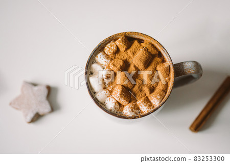 Cozy cup with hot cocoa, marshmallows and gingerbread 83253300
