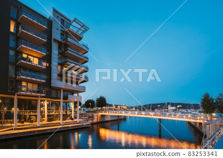 Oslo, Norway. Night View Of Residential Multi-storey Houses In Aker Brygge District. Summer Evening. Residential Area. Famous And Popular Place Oslo, Norway. Night View Of Residential Multi-storey Houses In Aker Brygge District. Summer Evening. Residential Area. Famous And Popular Place 83253341