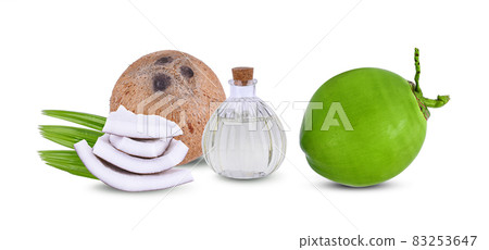 Oil bottle coconut and coconut on a white background Oil bottle coconut and coconut on a white background 83253647