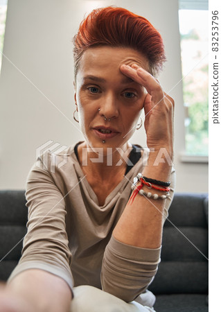 Woman with stress, depression or mental problem sitting and talking with doctor 83253796