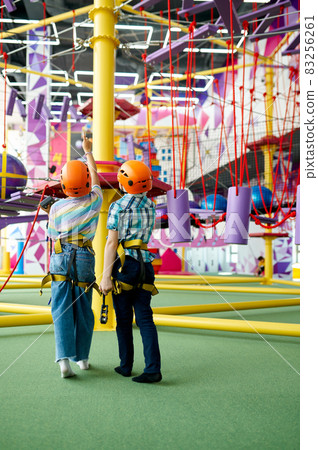 Two children in helmets, young climbers, back view 83256261