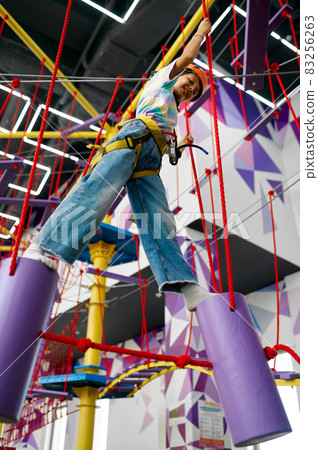 Children climb on zip line, little climbers Children climb on zip line, little climbers 83256263