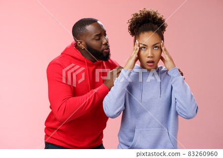 Man apologizing girlfriend behind back touching shoulder comforting girl feel pressured irritated fed up lying hear boyfriend sorry arguing standing bothered pink background, couple fighting Man apologizing girlfriend behind back touching shoulder comforting girl feel pressured irritated fed up lying hear boyfriend sorry arguing standing bothered pink background, couple fighting 83260960