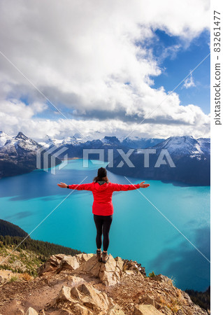 Adventurous Caucasian Woman hiking on top of a Canadian mountain. 83261477