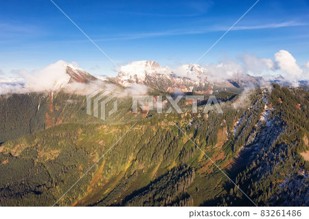 Aerial View of Canadian Rocky Mountains with snow on top during Fall Season. Aerial View of Canadian Rocky Mountains with snow on top during Fall Season. 83261486