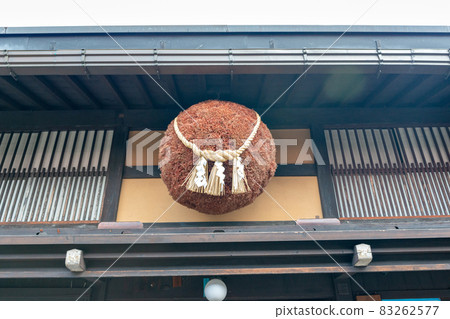 Sugitama hanging on the eaves of an old sake brewery in Sanmachi Suji, Takayama City, Gifu Prefecture 83262577