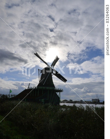 Silhouette of a windmill 83264063