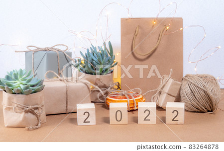 Year 2022 written on wooden cubes Christmas background craft style 83264878