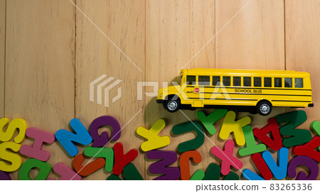 The  wood alphabet multi color  and school bus on table for education or kid concept 83265336