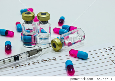 Vial of drugs or vaccine, 1 ml plastic syringe with needle, drug capsule and OPD card isolated on the white background Vial of drugs or vaccine, 1 ml plastic syringe with needle, drug capsule and OPD card isolated on the white background 83265604