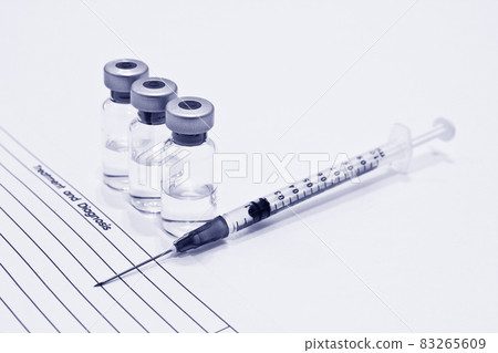 Vial of drugs or vaccine, 1 ml plastic syringe with needle and OPD card isolated on the white background, blue tone color Vial of drugs or vaccine, 1 ml plastic syringe with needle and OPD card isolated on the white background, blue tone color 83265609