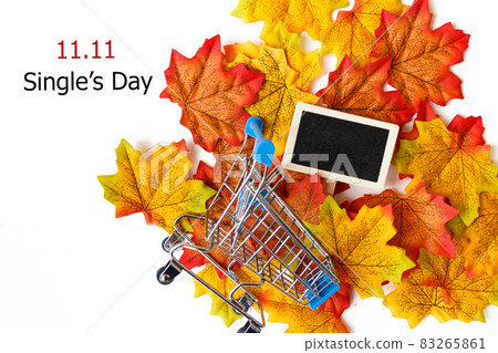 Single's day sale concept of China, 11.11. The shopping cart on maple leaf and text 11.11 single's day sale with copy space. Single's day sale concept of China, 11.11. The shopping cart on maple leaf and text 11.11 single's day sale with copy space. 83265861