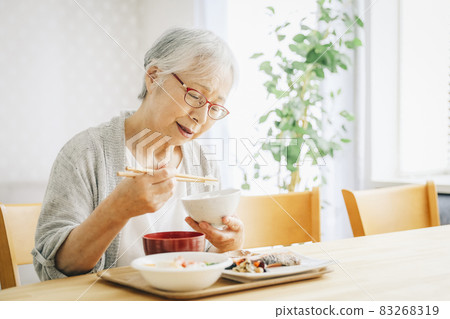 Elderly women eating (decreased appetite) Elderly women eating (decreased appetite) 83268319