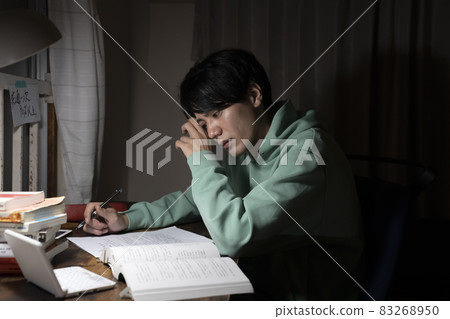 A man studying all night 83268950