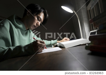 A man studying all night A man studying all night 83268963