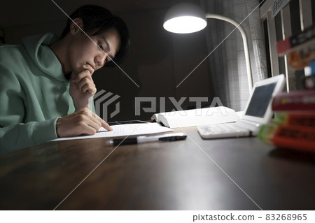 A man studying all night 83268965