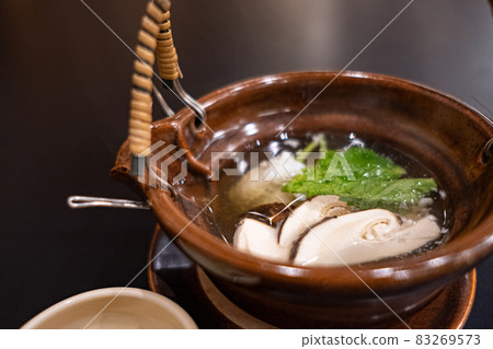 Japanese food, steamed matsutake mushrooms in a clay bottle Japanese food, steamed matsutake mushrooms in a clay bottle 83269573