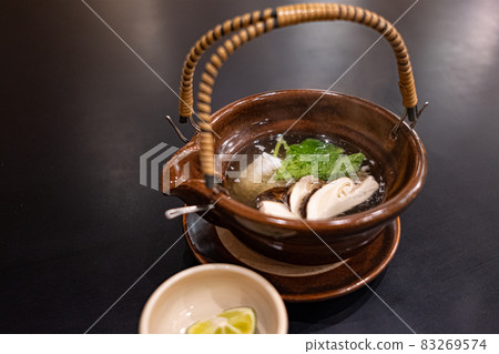 Japanese food, steamed matsutake mushrooms in a clay bottle Japanese food, steamed matsutake mushrooms in a clay bottle 83269574