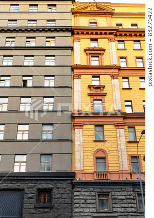 yellow and gray facades of houses in Moscow city 83270422