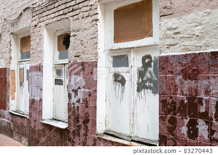 facade of poorly painted shabby tiled brick house facade of poorly painted shabby tiled brick house 83270443