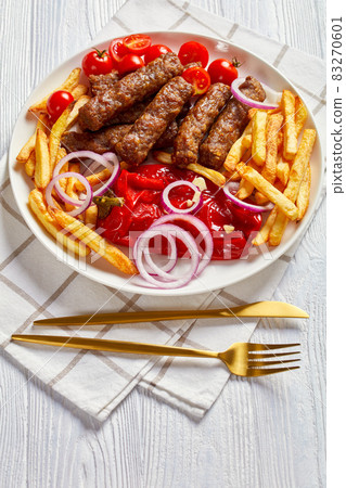 cevapcici with potato fries, red pepper, tomatoes 83270601