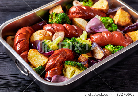 Sausage and vegetable traybake, top view, close-up 83270603