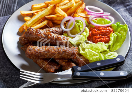 cevapcici with potato fries, lettuce, onion, ajvar 83270604