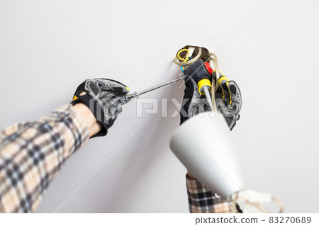 electrician repairing electric connection of lamp electrician repairing electric connection of lamp 83270689