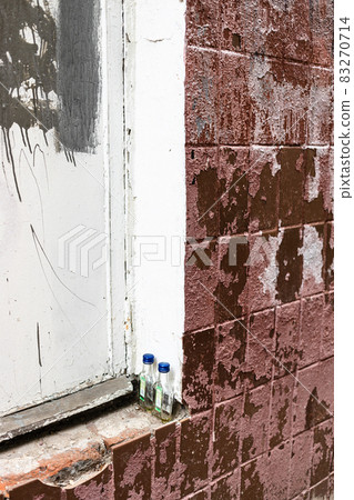 pair of drunk quarter-litre bottle on outer sill 83270714