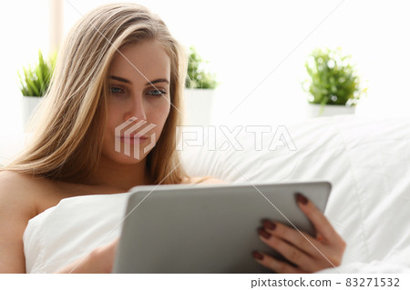 woman work winh laptop stay in bed early morning woman work winh laptop stay in bed early morning 83271532
