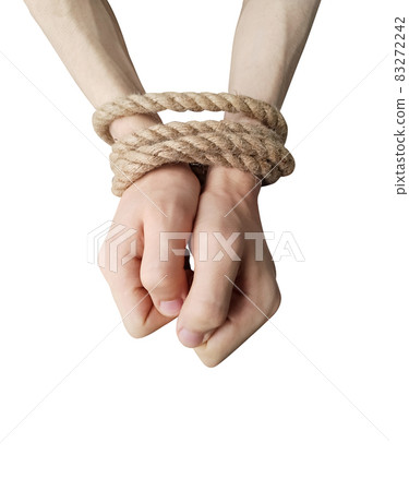 Teenager's hands tied with a rope isolated on white background Teenager's hands tied with a rope isolated on white background 83272242