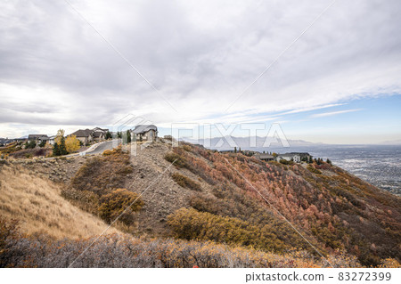 View of houses on top of the mountain during fall at Draper, Utah View of houses on top of the mountain during fall at Draper, Utah 83272399