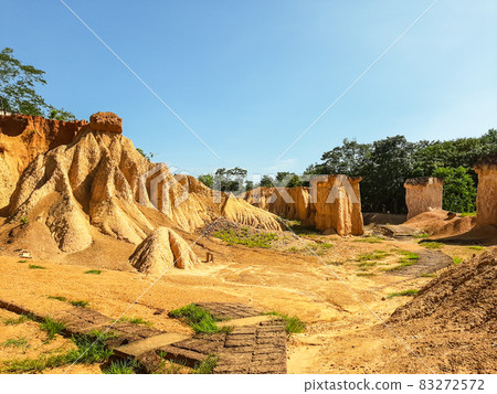 Within a national park named Phae Mueang Phi caused by the terrain which is the soil and sandstone was naturally eroded into various shapes that are In Phrae Province of Thailand. 83272572