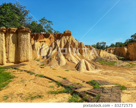 Within a national park named Phae Mueang Phi caused by the terrain which is the soil and sandstone was naturally eroded into various shapes that are In Phrae Province of Thailand. 83272573