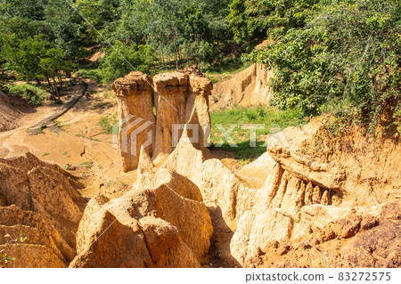 Within a national park named Phae Mueang Phi caused by the terrain which is the soil and sandstone was naturally eroded into various shapes that are In Phrae Province of Thailand. Within a national park named Phae Mueang Phi caused by the terrain which is the soil and sandstone was naturally eroded into various shapes that are In Phrae Province of Thailand. 83272575