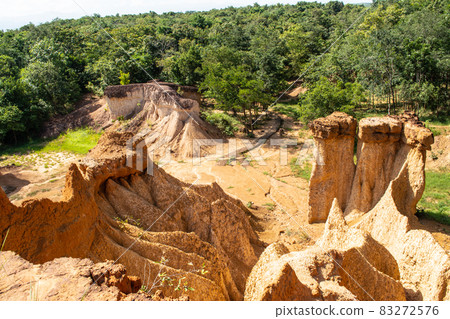 Within a national park named Phae Mueang Phi caused by the terrain which is the soil and sandstone was naturally eroded into various shapes that are In Phrae Province of Thailand. 83272576