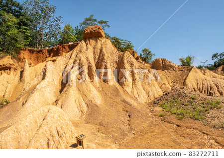 Within a national park named Phae Mueang Phi caused by the terrain which is the soil and sandstone was naturally eroded into various shapes that are In Phrae Province of Thailand. Within a national park named Phae Mueang Phi caused by the terrain which is the soil and sandstone was naturally eroded into various shapes that are In Phrae Province of Thailand. 83272711