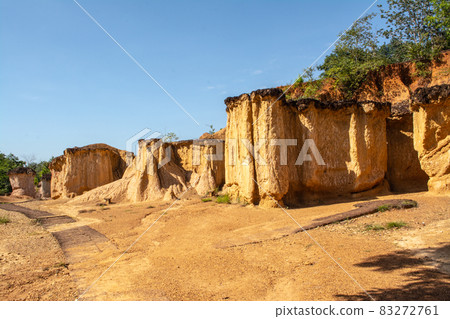 Within a national park named Phae Mueang Phi caused by the terrain which is the soil and sandstone was naturally eroded into various shapes that are In Phrae Province of Thailand. Within a national park named Phae Mueang Phi caused by the terrain which is the soil and sandstone was naturally eroded into various shapes that are In Phrae Province of Thailand. 83272761